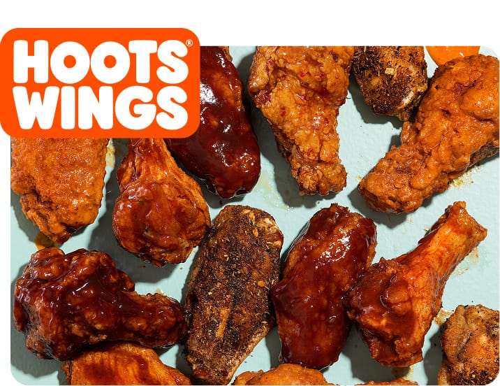 A tray of wings covered in a variety of sauces